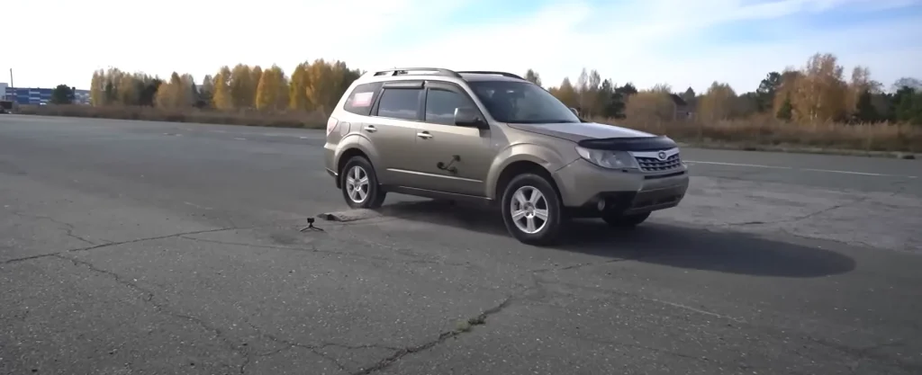 Man tests out driving over a speed bump at high speeds to see what actually happens