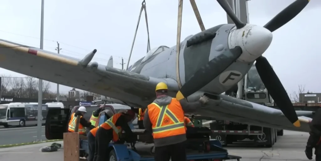 Crane removes iconic Spitfire replica after nearly 30 years in Canada as residents gather to say goodbye