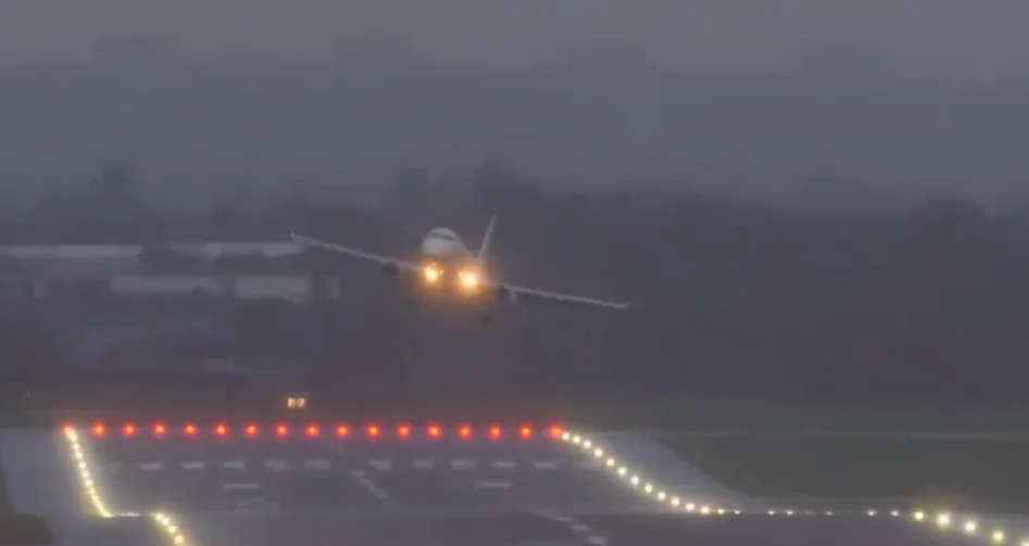 Wild footage shows Embraer E190 having to abort landing because the stormy winds are too strong