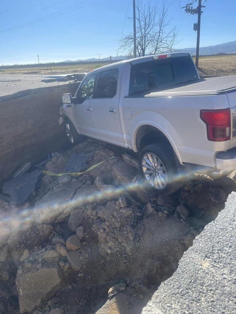 Ford F-150 drives into sinkhole