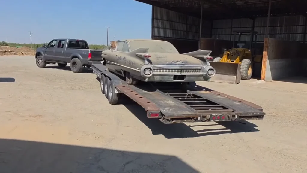Woman waiting patiently to find a factory fresh 1959 Cadillac Coupe De Ville finds one in a barn after 20 years