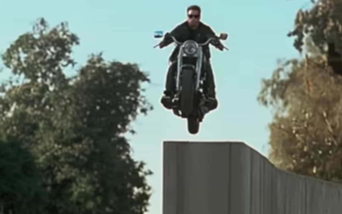 The Terminator jumps from a ledge on a motorcycle.