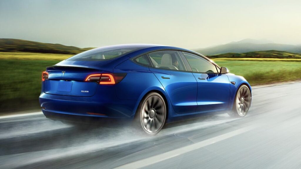 Tesla Model 3 driving on road