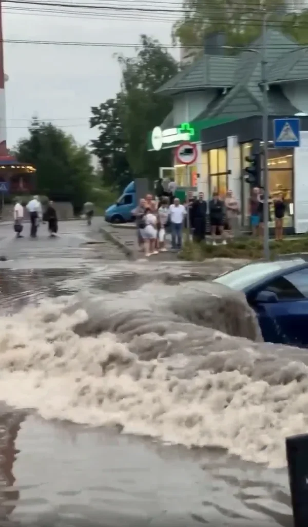 Tesla Model 3 spotted driving through a completely flooded street and it's definitely not something you'd see every day