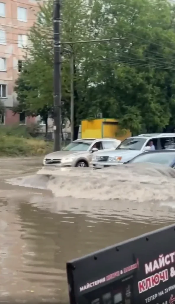 Tesla Model 3 spotted driving through a completely flooded street and it's definitely not something you'd see every day