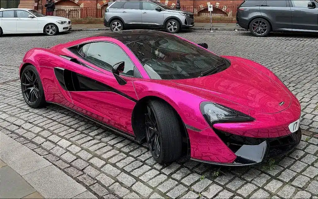 The mystery of pink McLaren 570S that's been sitting outside St. Pancras hotel in London has been solved