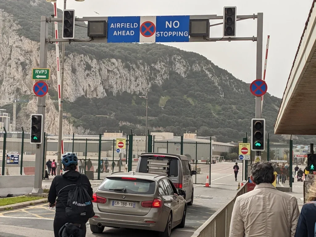There's an airport in Europe that's famous for its infamously strong crosswinds, but also because of the fact the runway is interrupted by a road