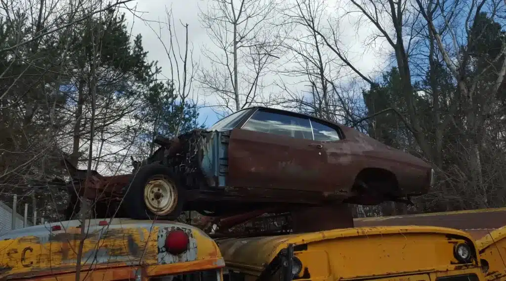 This YouTuber found a huge junkyard in Michigan with some abandoned muscle cars