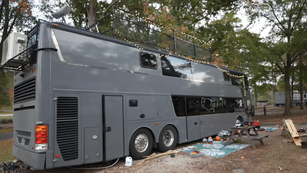 This guy converted a double-decker bus into a two storey home for his family of 8