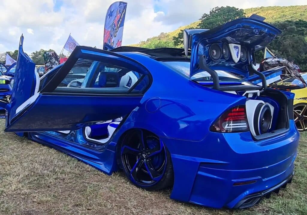 This insane modded car with custom spinning doors is an absolute show stopper