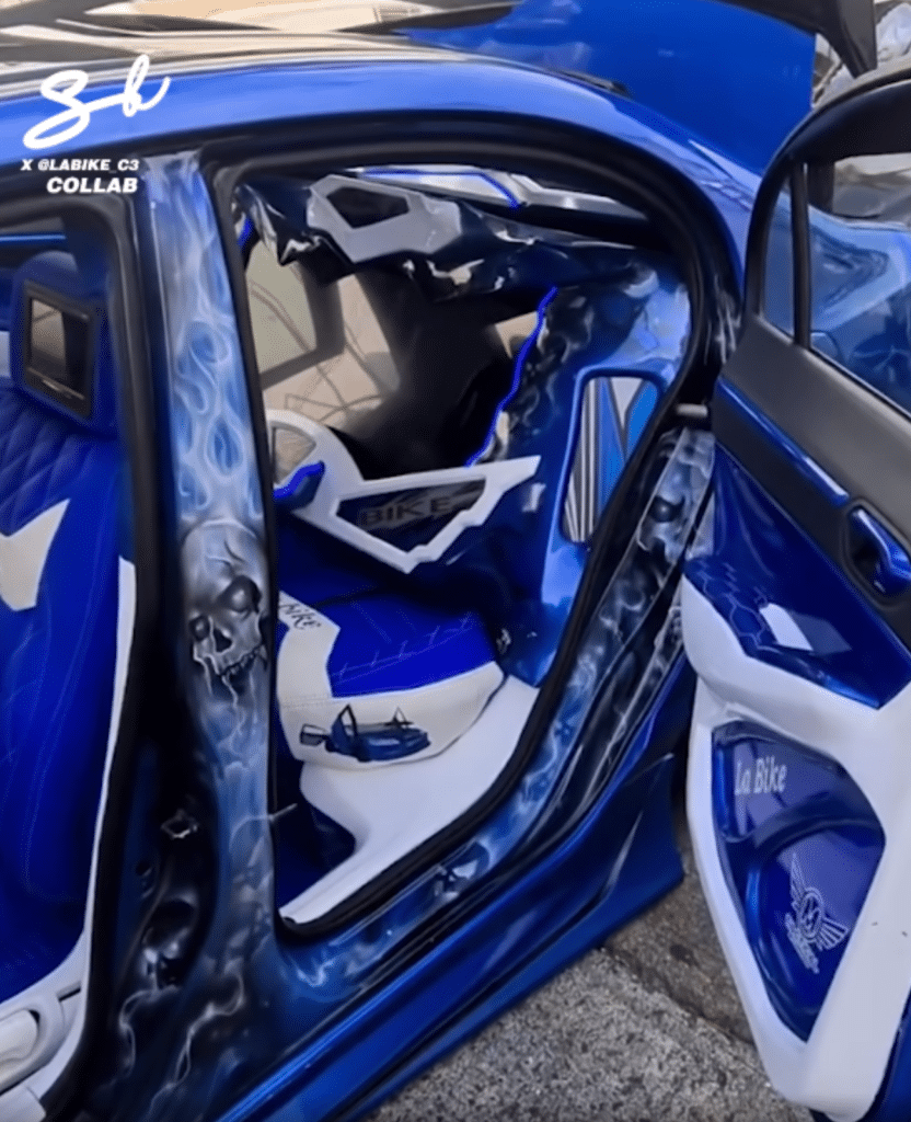 This insane modded car with custom spinning doors is an absolute show stopper