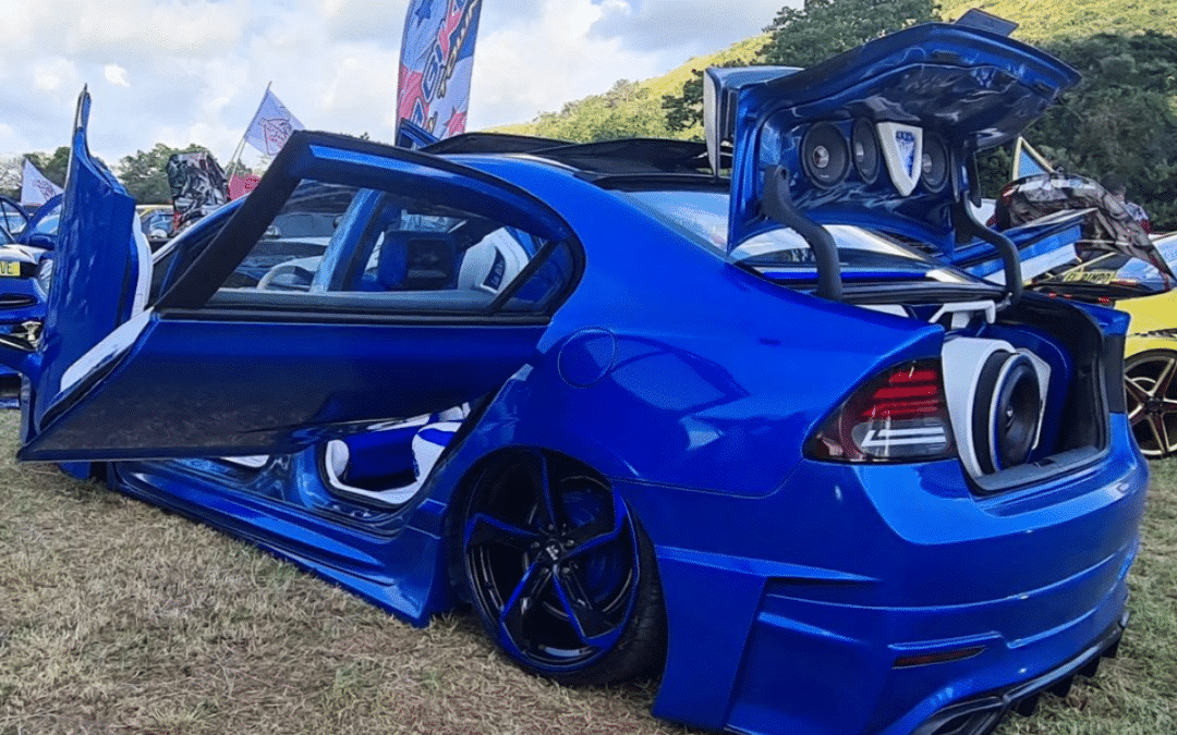 This insane modded car with custom spinning doors is an absolute show-stopper