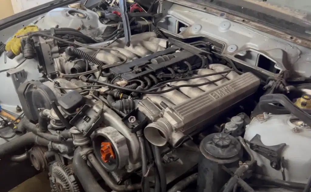 This V12 Hybrid 6x6 BMW build combines EV torque, Tesla motor tech, and twin-turbo mods into a luxury pickup powerhouse