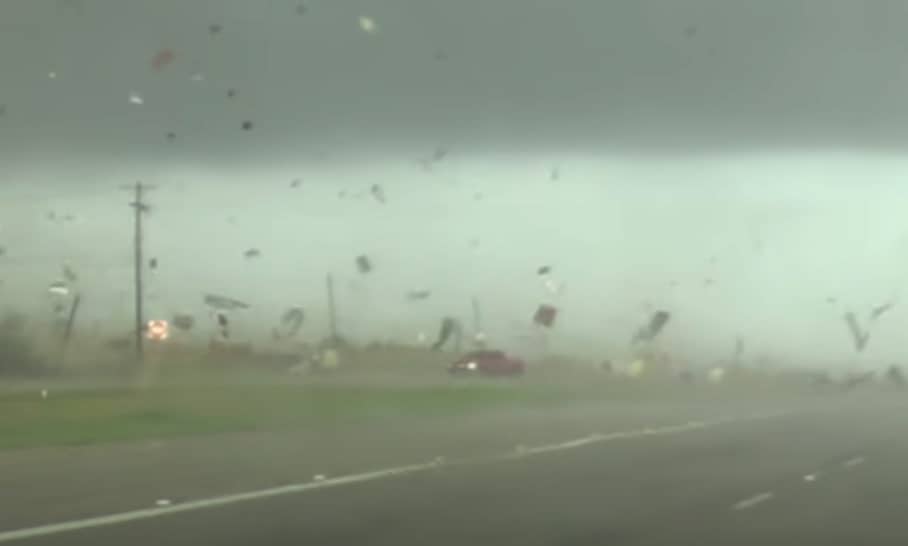 Tornado flips this red truck