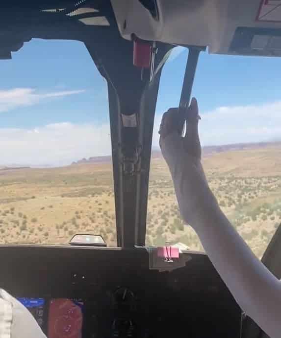Tourist grabs helicopter lever