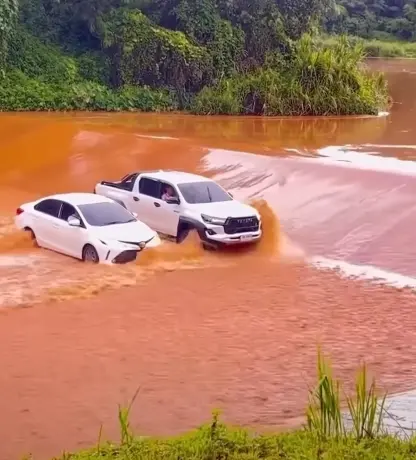 Toyota Hilux GR Sport shows off its unreal power and strength by driving alongside Toyota Corolla Altis to block it from heavy floodwaters