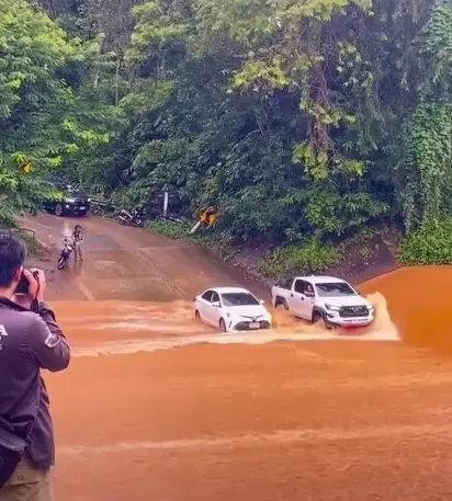 Toyota Hilux GR Sport shows off its unreal power and strength by driving alongside Toyota Corolla Altis to block it from heavy floodwaters