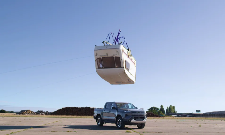 Toyota drops a caravan on an electric Hilux in a classic Top Gear throwback to see if the EV can survive