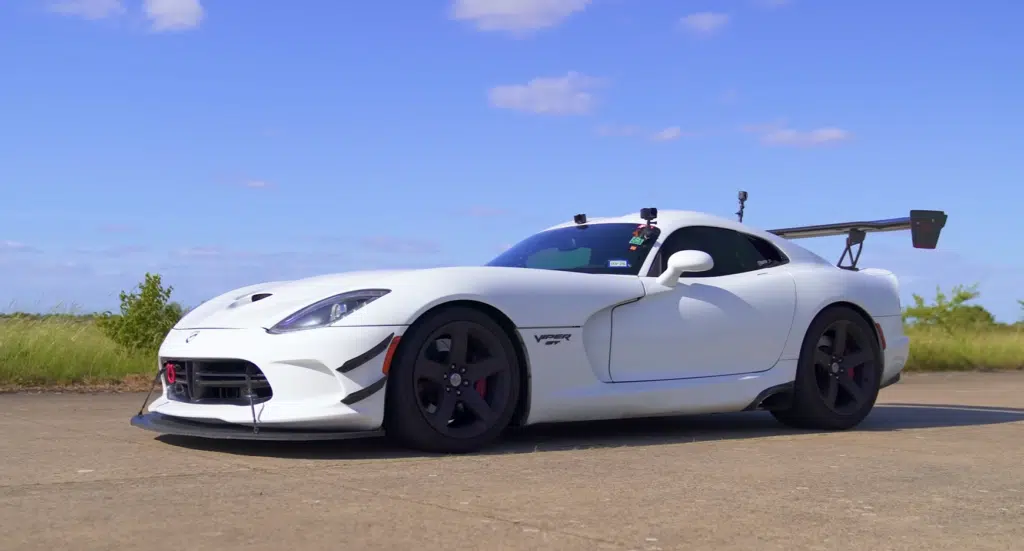 A supercharged Ford Mustang faces a Dodge Viper in a tuned V8 drag race, testing torque, weight, and real-world performance across multiple formats