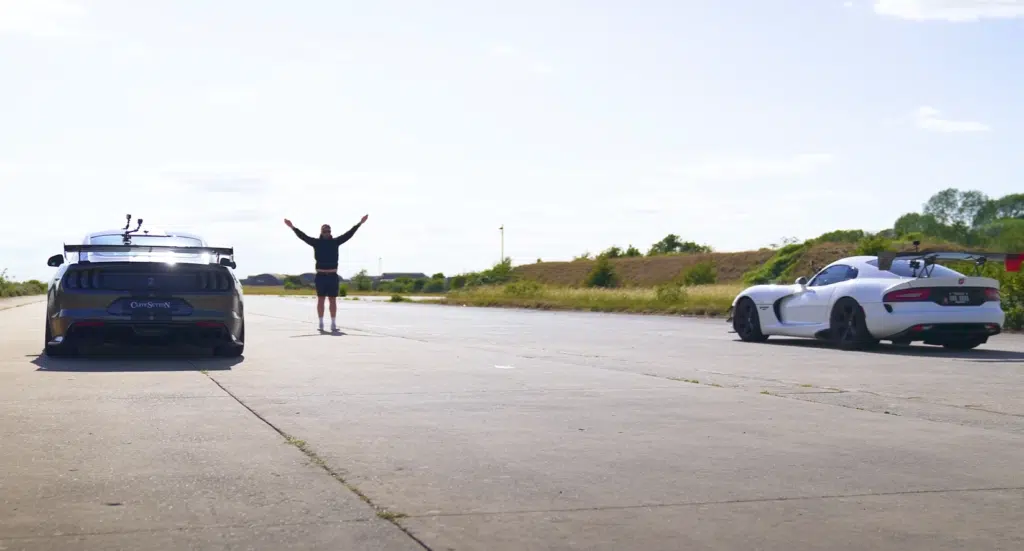 A supercharged Ford Mustang faces a Dodge Viper in a tuned V8 drag race, testing torque, weight, and real-world performance across multiple formats