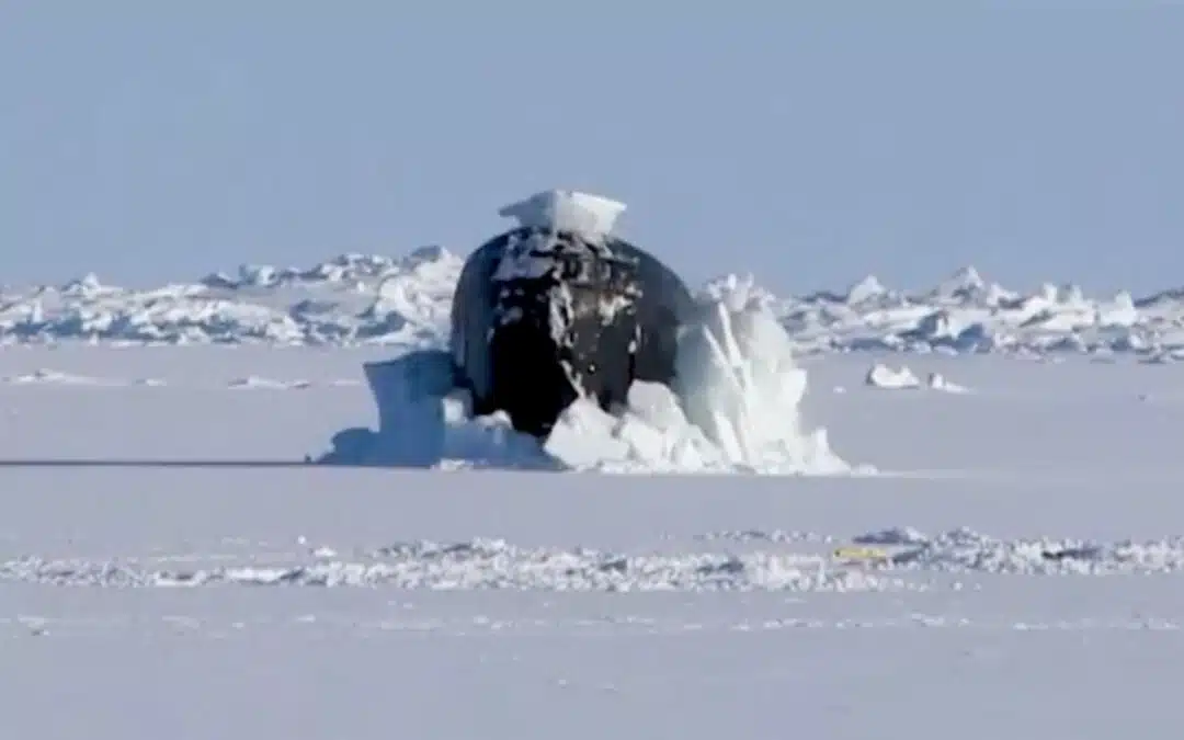 Watch this $2 billion submarine emerge from a thick layer of ice ...