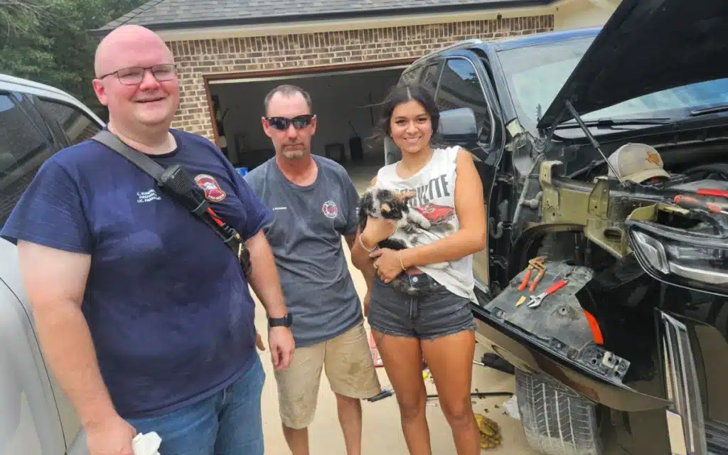 Texas firefighters praised for freeing cat that had gotten stuck in Cadillac's engine bay