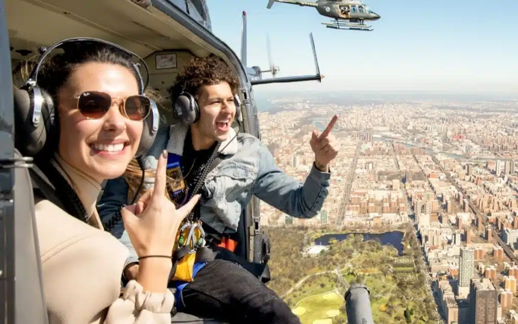 People shocked after seeing what a doorless helicopter ride does to a passenger's leg