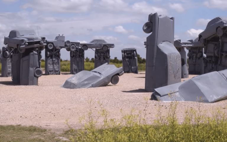 In Nebraska, 39 spray-painted cars stand in a perfect circle. Carhenge is a Nebraska car monument that’s part tribute, part art, and entirely unexpected.