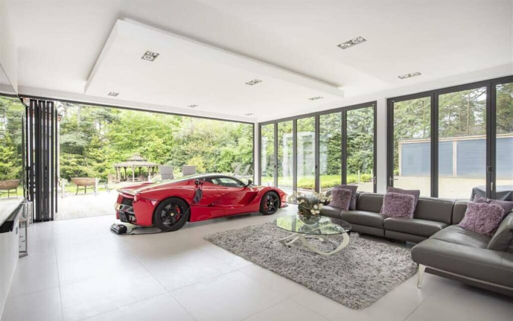 To lure in buyers luxury mansion owner parked a .2 million Ferrari in living room