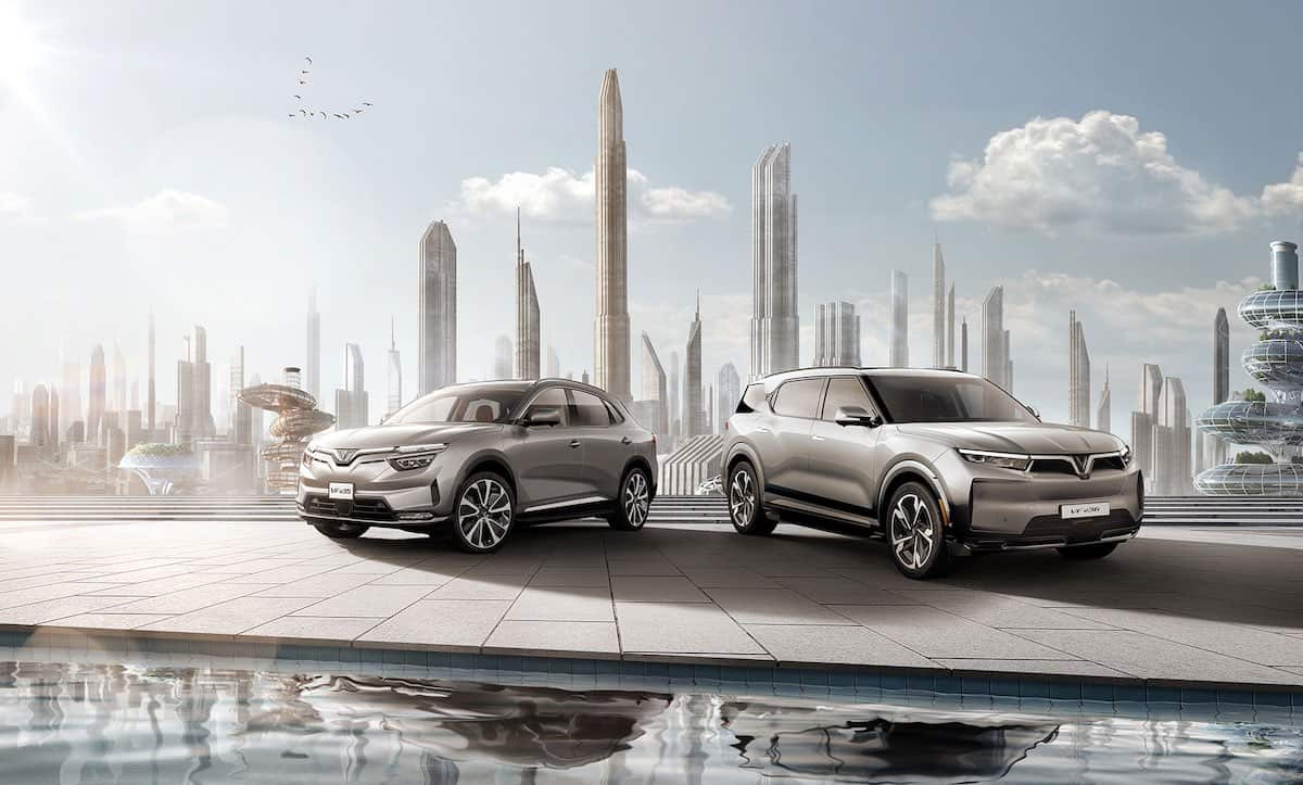 VinFast VF8 and VF9 electric SUV in front of city skyline