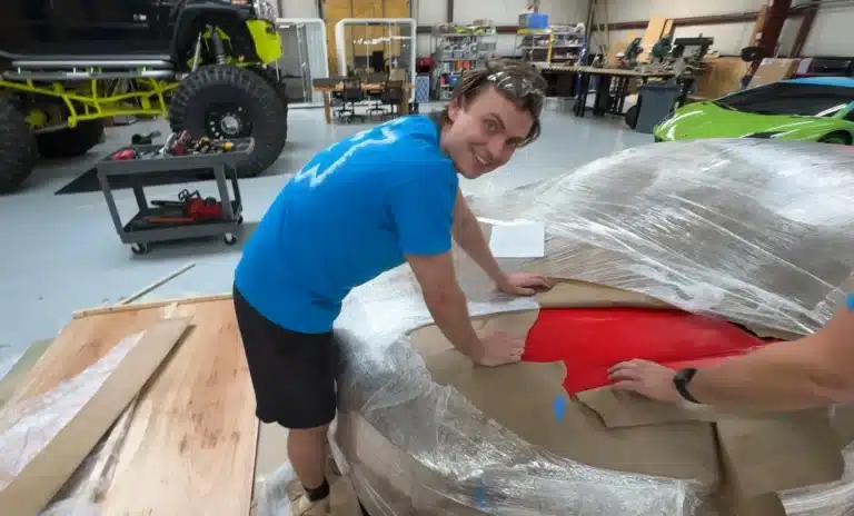 A YouTuber bought a cheap Bugatti from an Alibaba car listing, but the delivery revealed a foam Bugatti replica instead of a real supercar