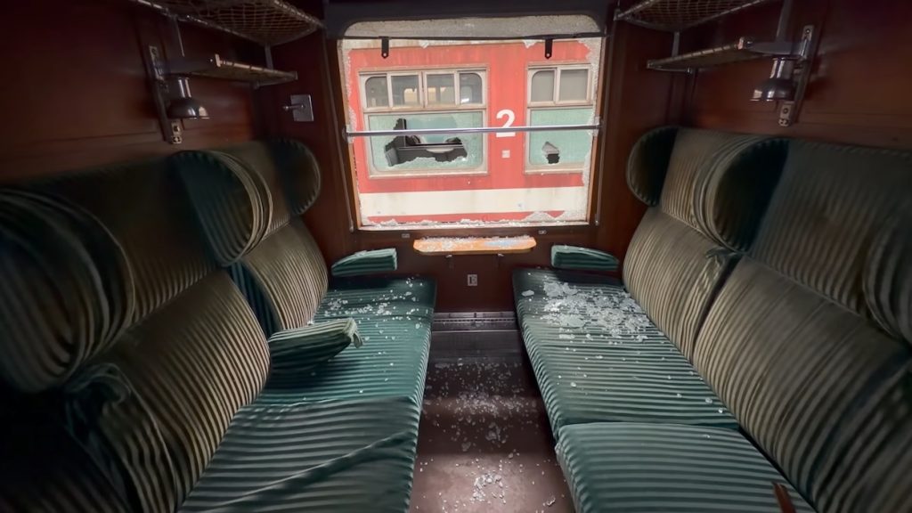 Explorers find hundreds of rotting trains in abandoned warehouse and many are holding dark secrets