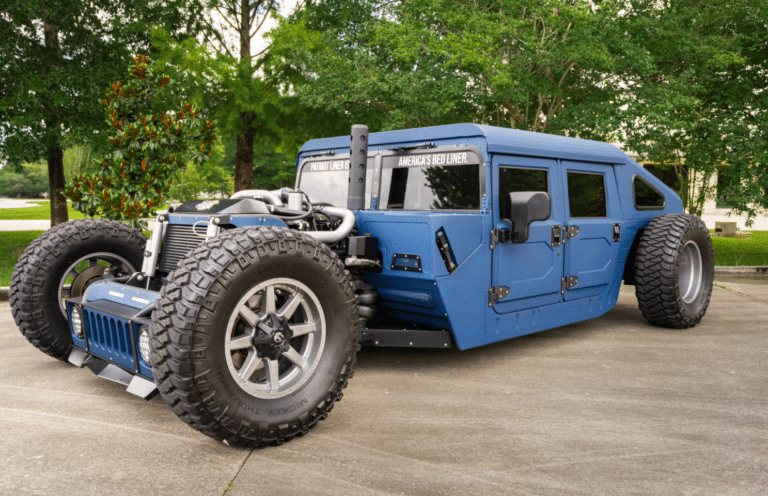 This 1980s military Humvee features a custom interior, air suspension, and wild rat rod styling with a 750-hp Duramax engine and open-engine layout