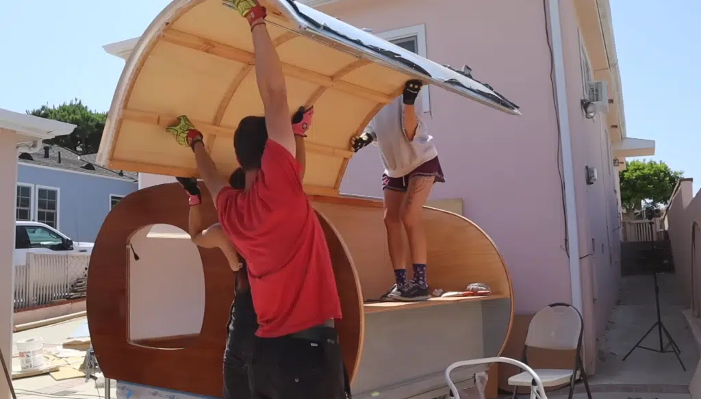 This DIY camper build features a teardrop camper on a custom trailer, completed in just three weeks using CAD tools and lightweight materials