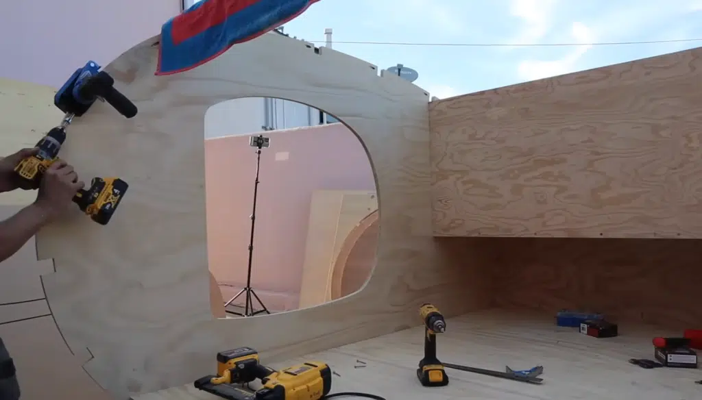 This DIY camper build features a teardrop camper on a custom trailer, completed in just three weeks using CAD tools and lightweight materials