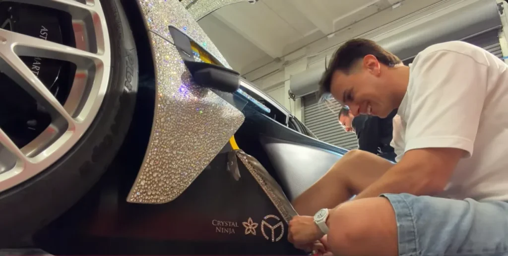 This YouTuber decided to take the crystal-bedazzled wrap off his Aston Martin Valkyrie Spider - and he documented the whole process