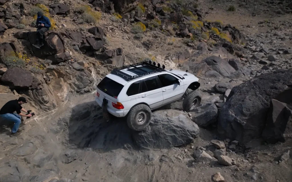 This heavily modified off-roader had once been just a regular BMW X5, the kind you’d expect to see doing school runs rather than climbing rocks.