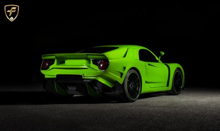 The rear view of a green Anomalya supercar.
