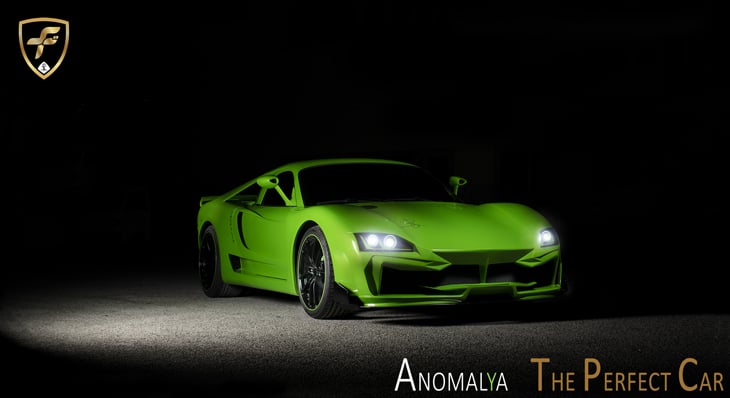 The front end of a green Anomalya car.