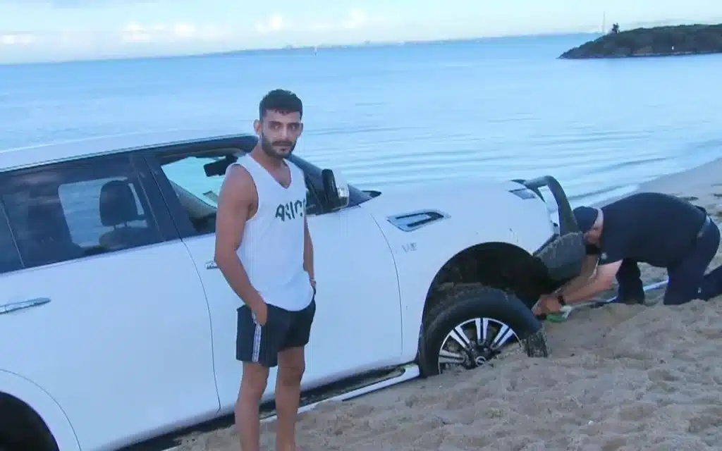 Despite the four-wheel drive, tourist managed to get his Nissan Patrol hire car stuck on Australia beach