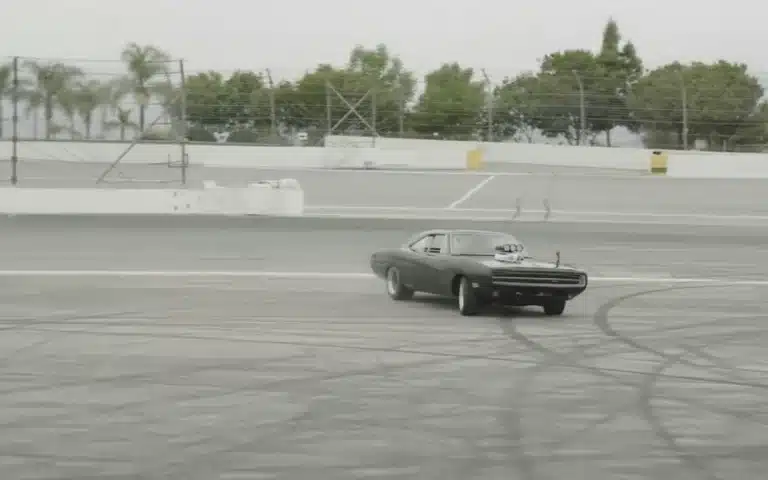 Vin Diesel promoting the next Fast & Furious movie, Fast X: Part 2, by doing donuts with his Dodge Charger