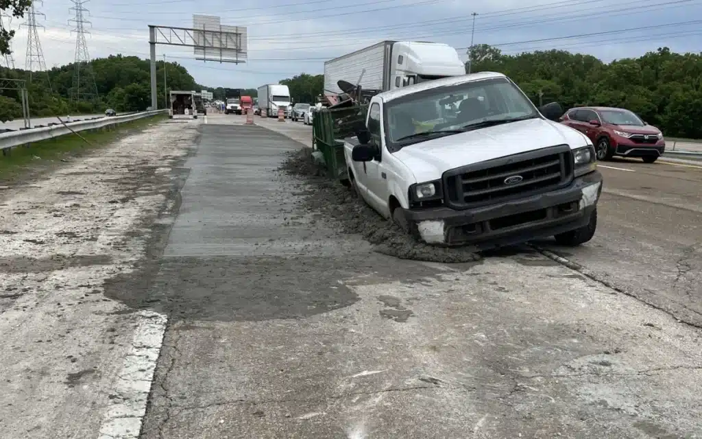 Truck driver makes comical error while towing trailer on Tennessee road and drives through wet cement