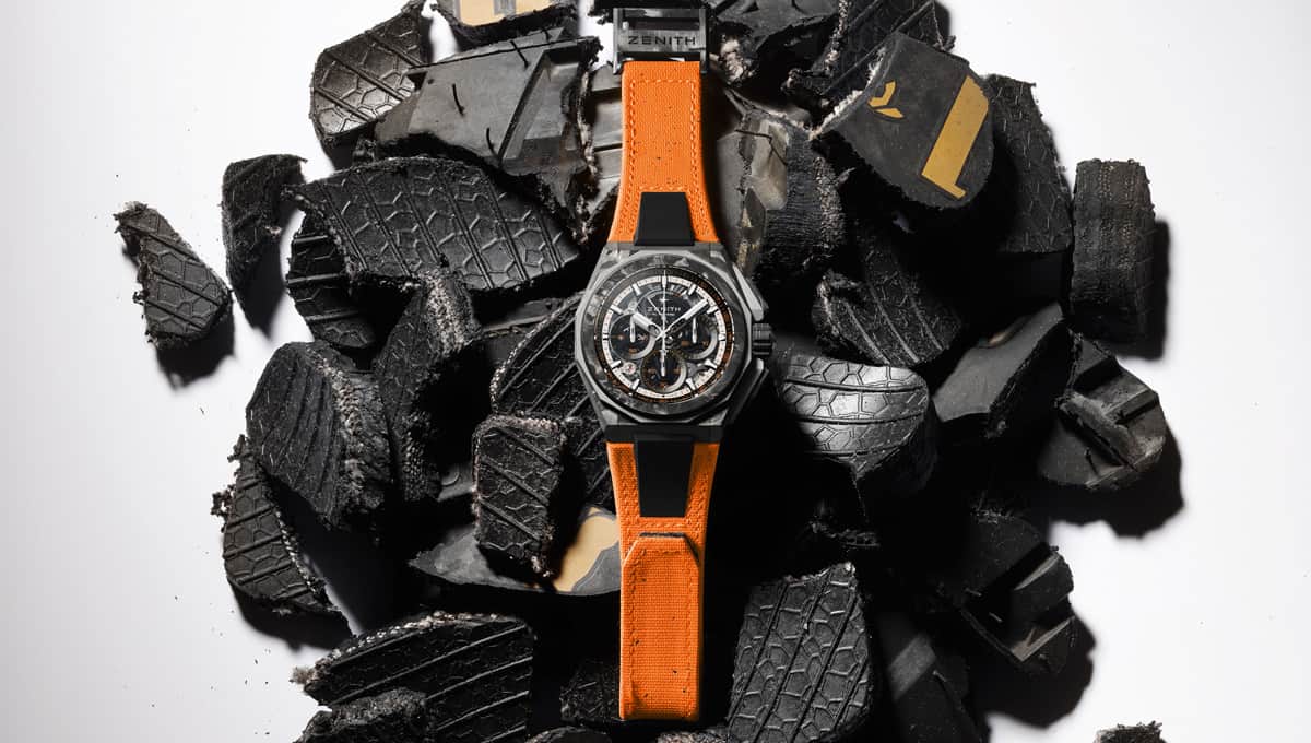 Zenith watch with bits of tires in the backdrop