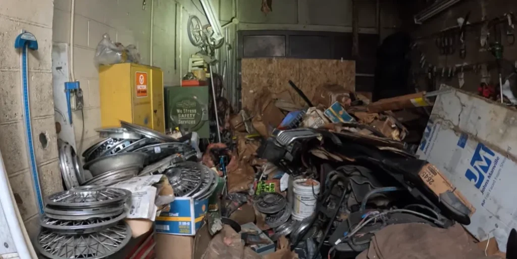 Chevy Corvette sitting on a lift for 50 years in an abandoned building is frozen in time with an unbelievable secret
