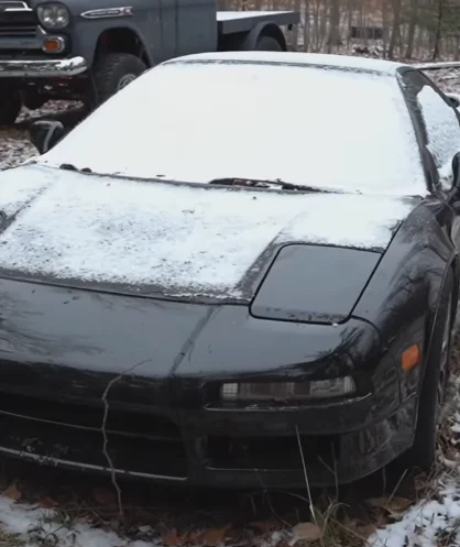 Man can't find believe it after seeing everyone's dream car abandoned in the Michigan woods