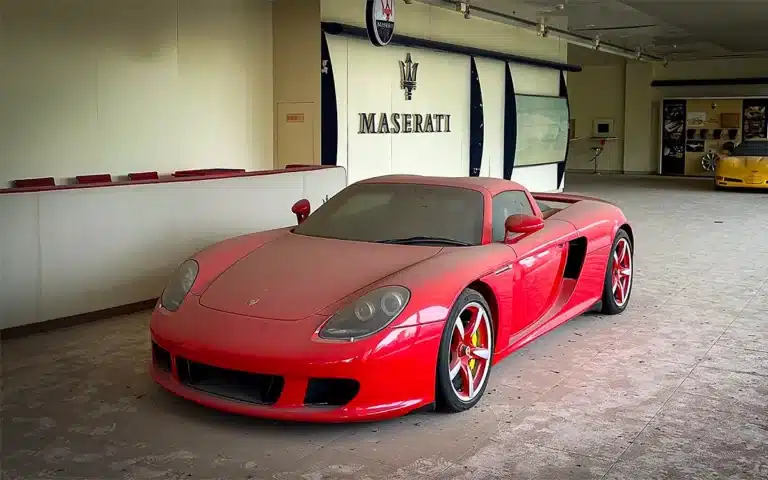 abandoned Porsche Carrera GT in abandoned dealership in China