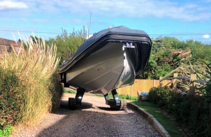 Amphibious boat in a customer's driveway