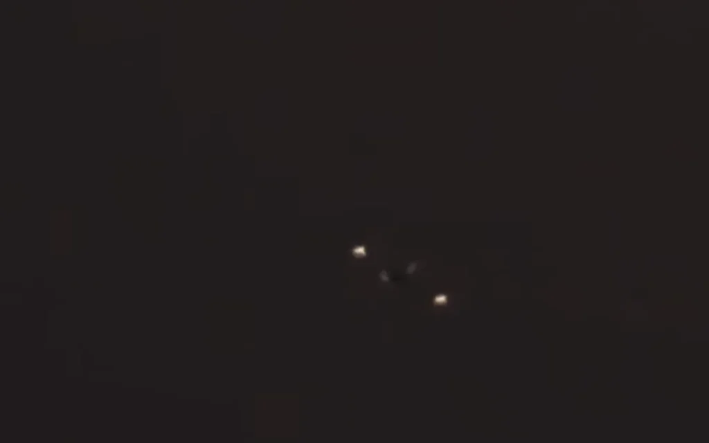 Washington YouTuber Johnny Harris road-trips to Area 51, hikes Tikaboo Peak, and captures jets, midnight runway lights, and a mystery fly-by - but no UFO