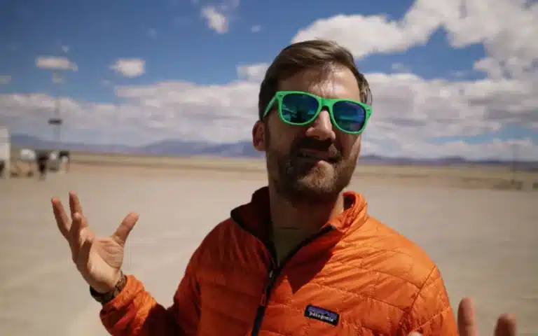 Washington YouTuber Johnny Harris road-trips to Area 51, hikes Tikaboo Peak, and captures jets, midnight runway lights, and a mystery fly-by - but no UFO