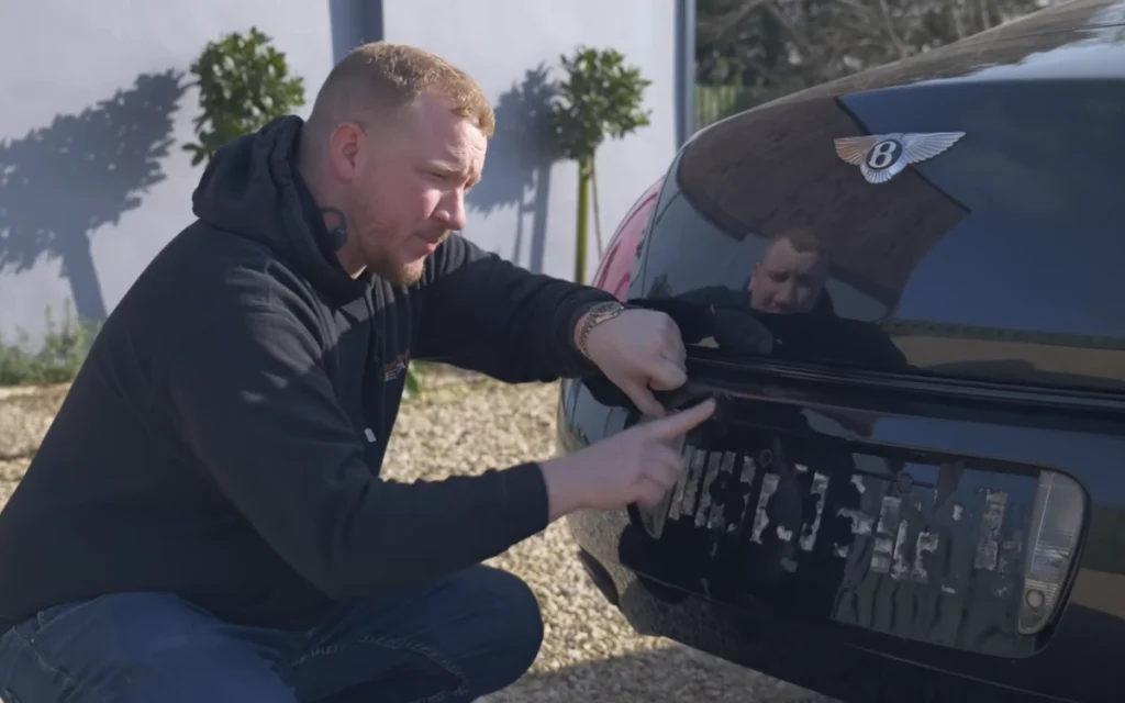 A YouTuber decided to peel the bright orange wrap off his cheap Bentley Continental GT and see what secrets the luxury coupe had been hiding for years. 